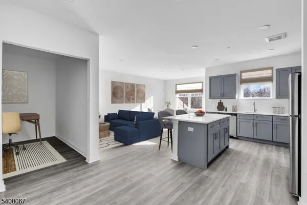 a living room with a couch and a stove top oven