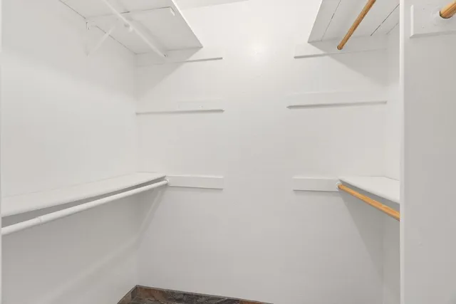 a view of an empty walk in closet
