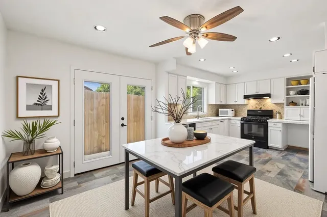 a dining room with furniture and window