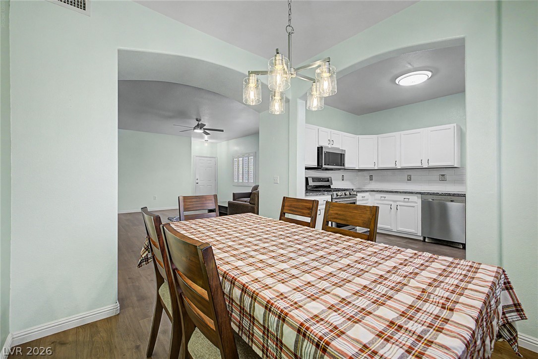 2153 Quarry Ridge Street, Unit 103 Las Vegas, NV 89117 - Photo 16 of 42 An open concept design seamlessly connects the dining area to a well-appointed kitchen and living space, ideal for daily living.