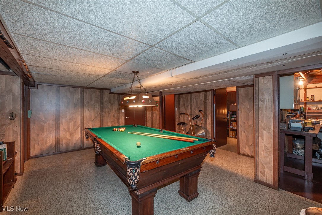750 Sagamore Road Northfield, OH 44067 - Photo 32 of 37 Game room featuring a drop ceiling, pool table, and paneled walls