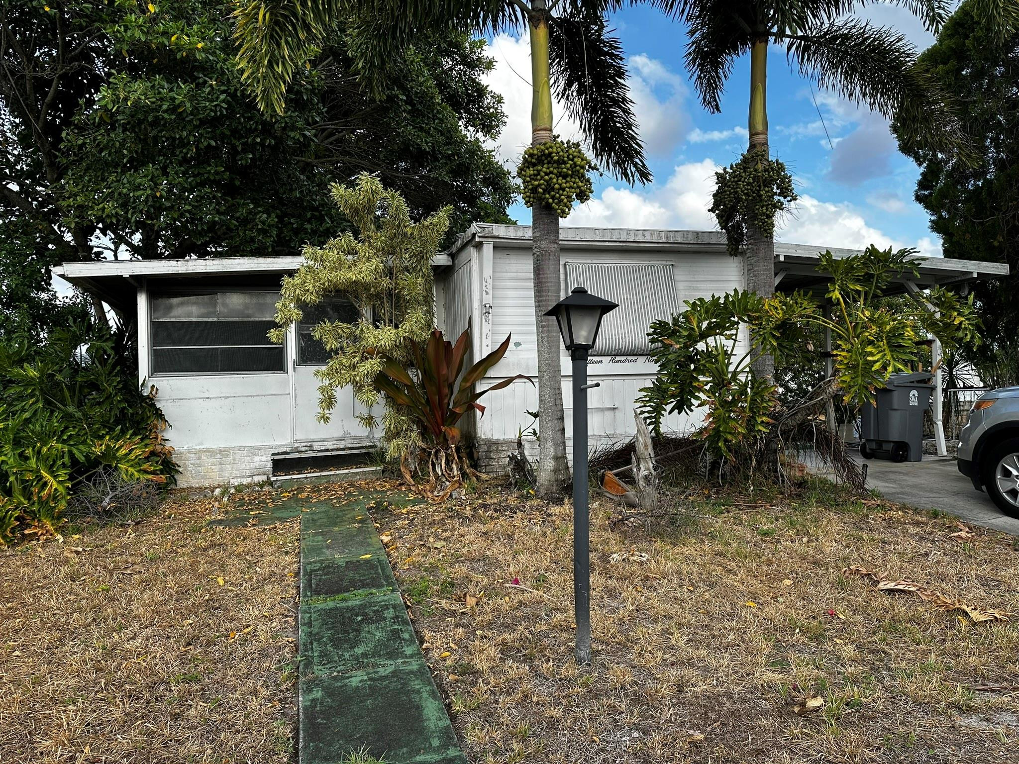 1590 Southwest 65th Terrace Boca Raton, FL 33428 - Photo 1 of 13 a house view with a outdoor space