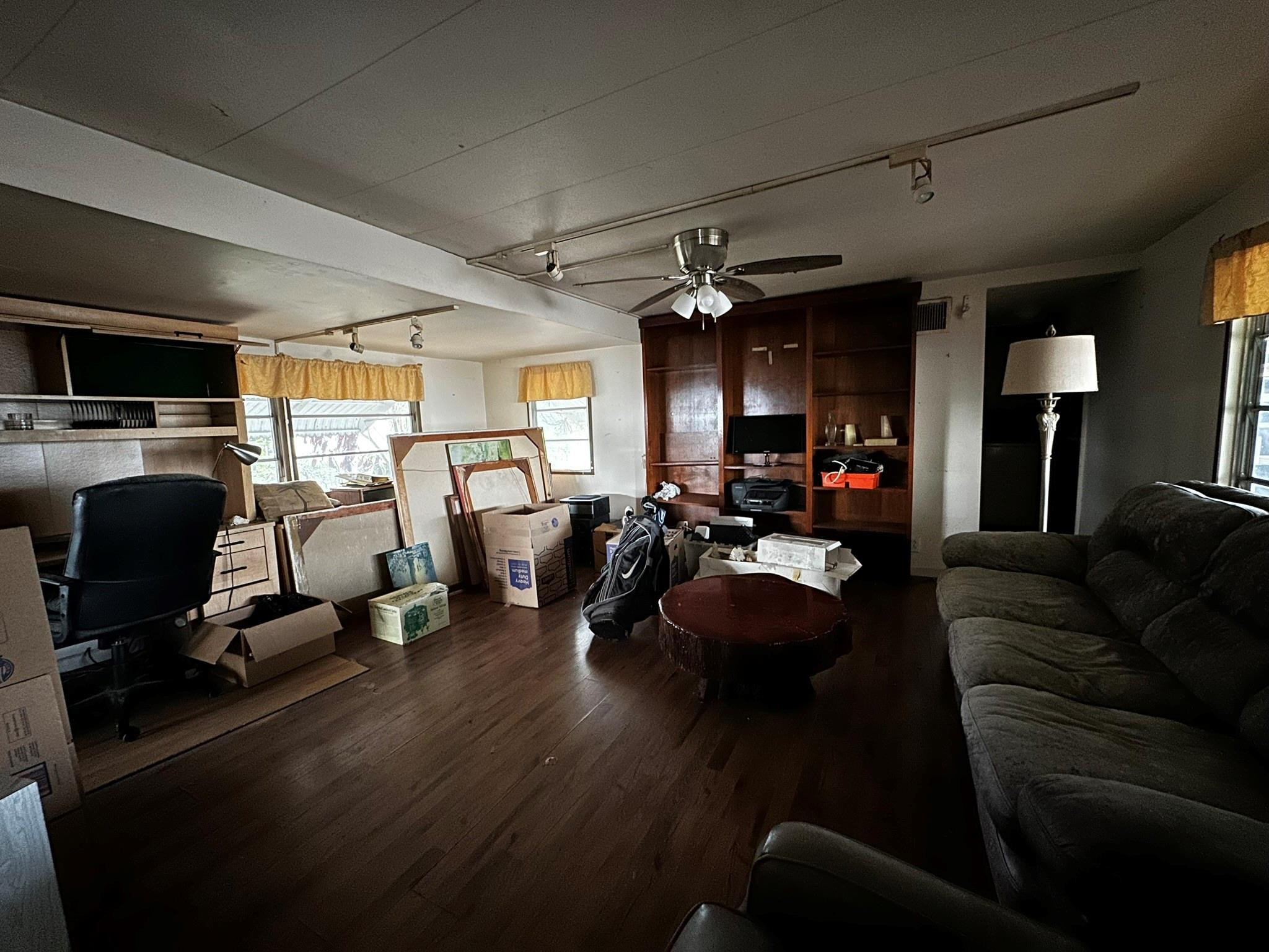 1590 Southwest 65th Terrace Boca Raton, FL 33428 - Photo 6 of 13 a living room with furniture a flat screen tv and a window