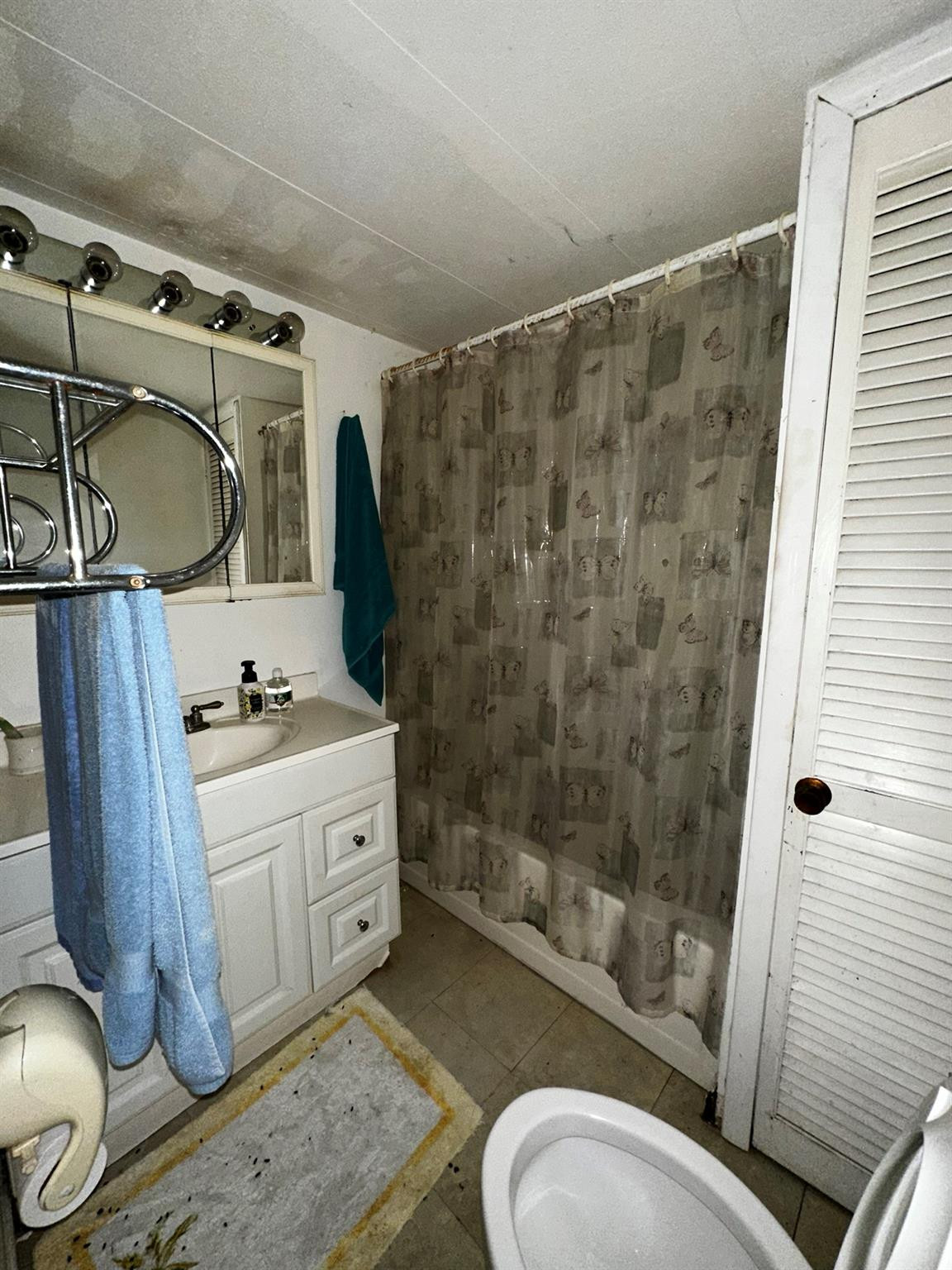 1590 Southwest 65th Terrace Boca Raton, FL 33428 - Photo 10 of 13 a spacious bathroom with a granite countertop sink toilet and shower
