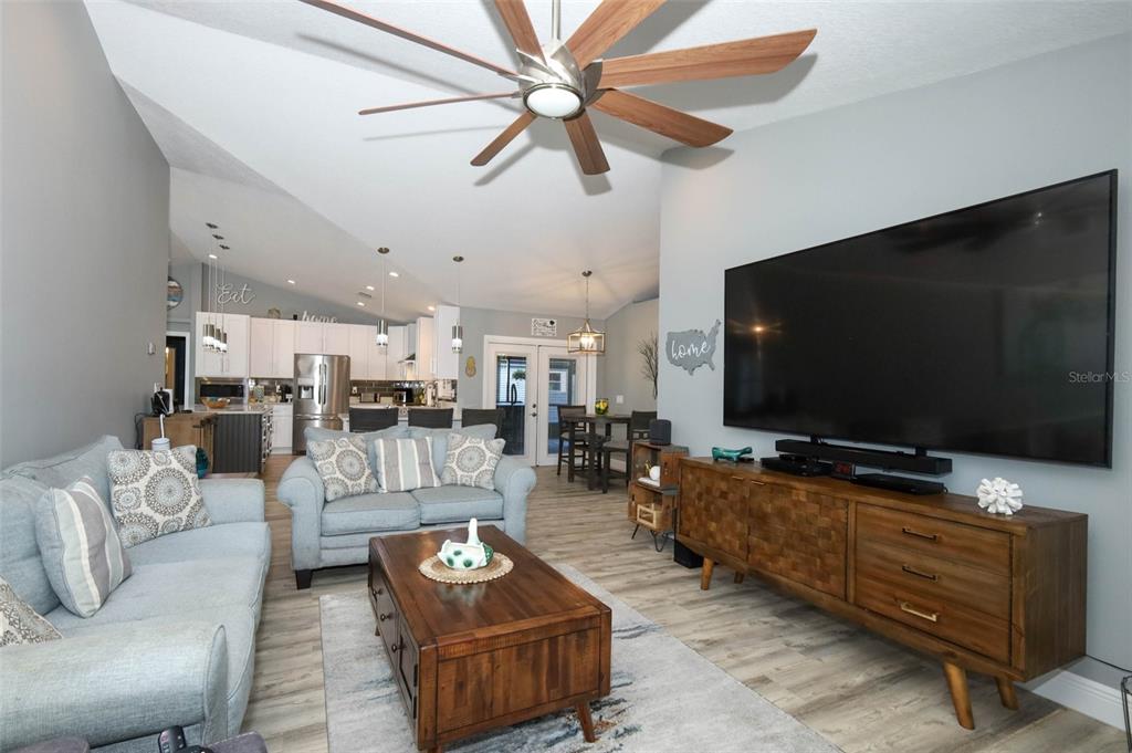 424 Meadow Green Drive Davenport, FL 33837 - Photo 18 of 47 a living room with furniture and a flat screen tv