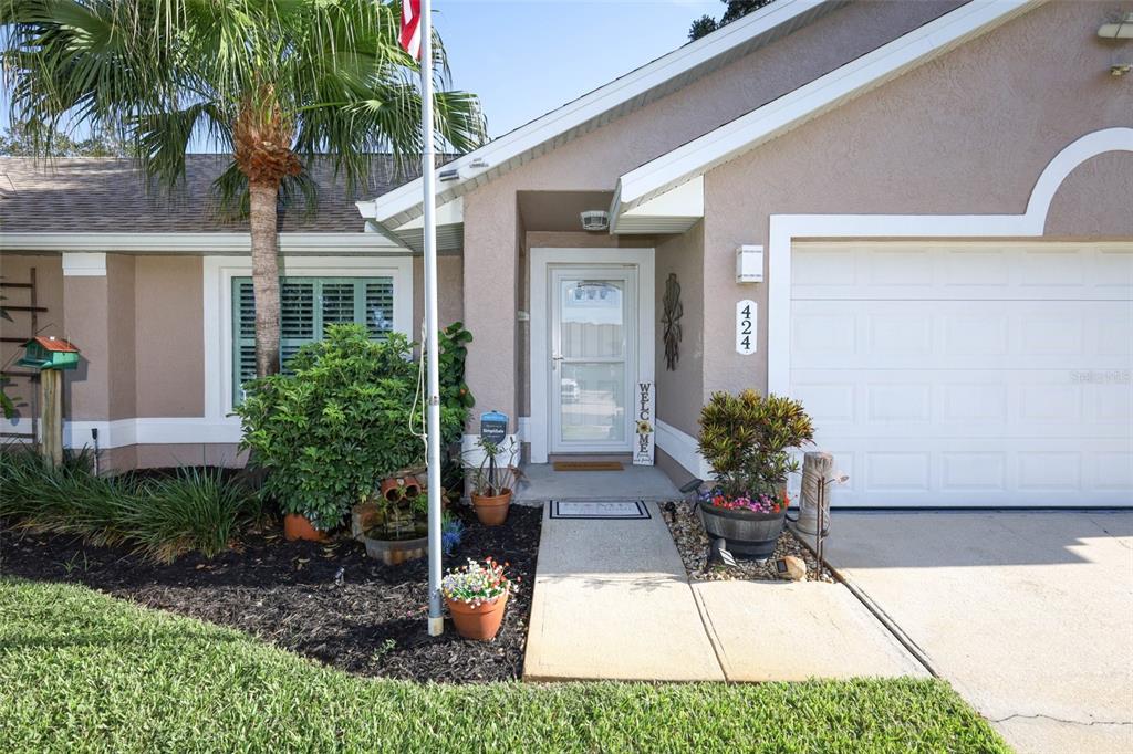 424 Meadow Green Drive Davenport, FL 33837 - Photo 2 of 47 a view of a house with backyard and sitting area