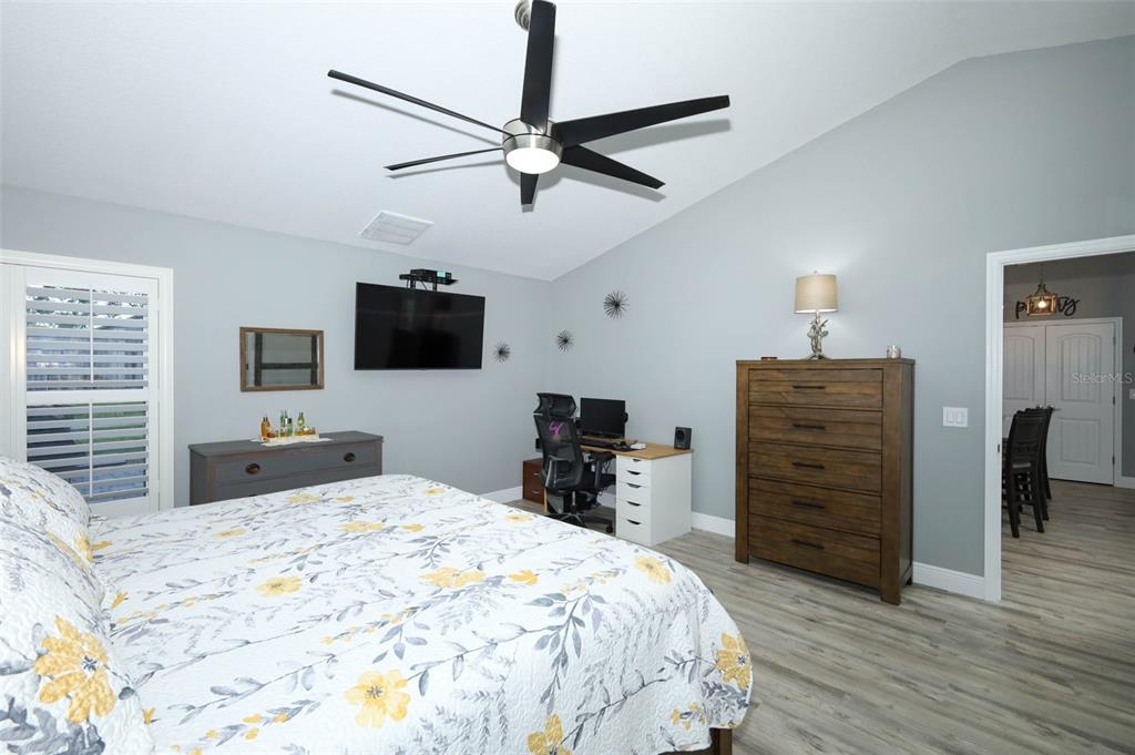424 Meadow Green Drive Davenport, FL 33837 - Photo 23 of 47 a bedroom with a bed and a dresser