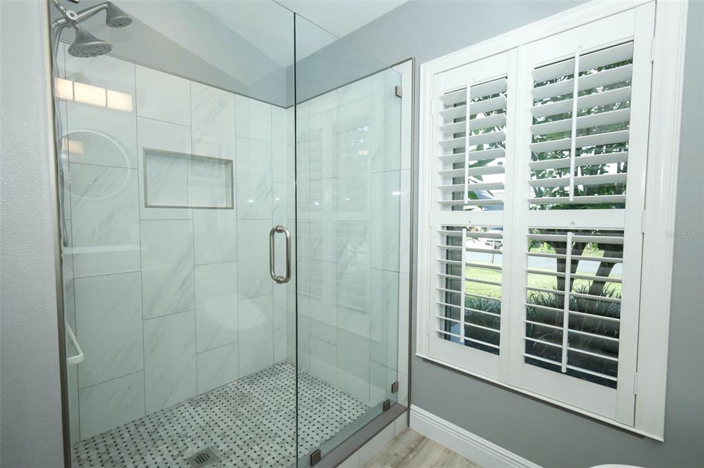 424 Meadow Green Drive Davenport, FL 33837 - Photo 27 of 47 a bathroom with a shower