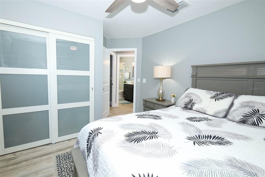 424 Meadow Green Drive Davenport, FL 33837 - Photo 33 of 47 a large white bed in a white room