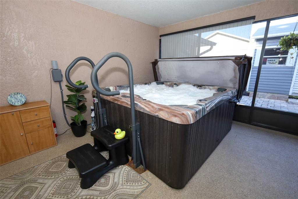 424 Meadow Green Drive Davenport, FL 33837 - Photo 37 of 47 a bedroom with a bed and a dresser next to a window