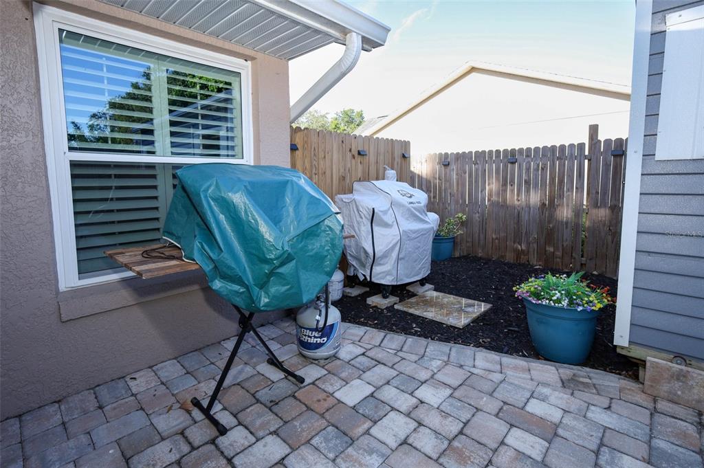424 Meadow Green Drive Davenport, FL 33837 - Photo 41 of 47 a view of a backyard with furniture and a potted plant