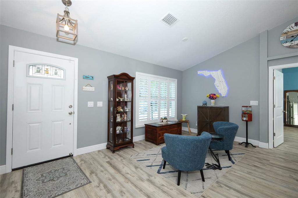 424 Meadow Green Drive Davenport, FL 33837 - Photo 6 of 47 a living room with furniture and a window