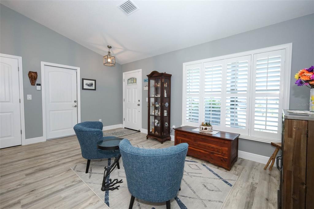 424 Meadow Green Drive Davenport, FL 33837 - Photo 7 of 47 a living room with furniture and a window