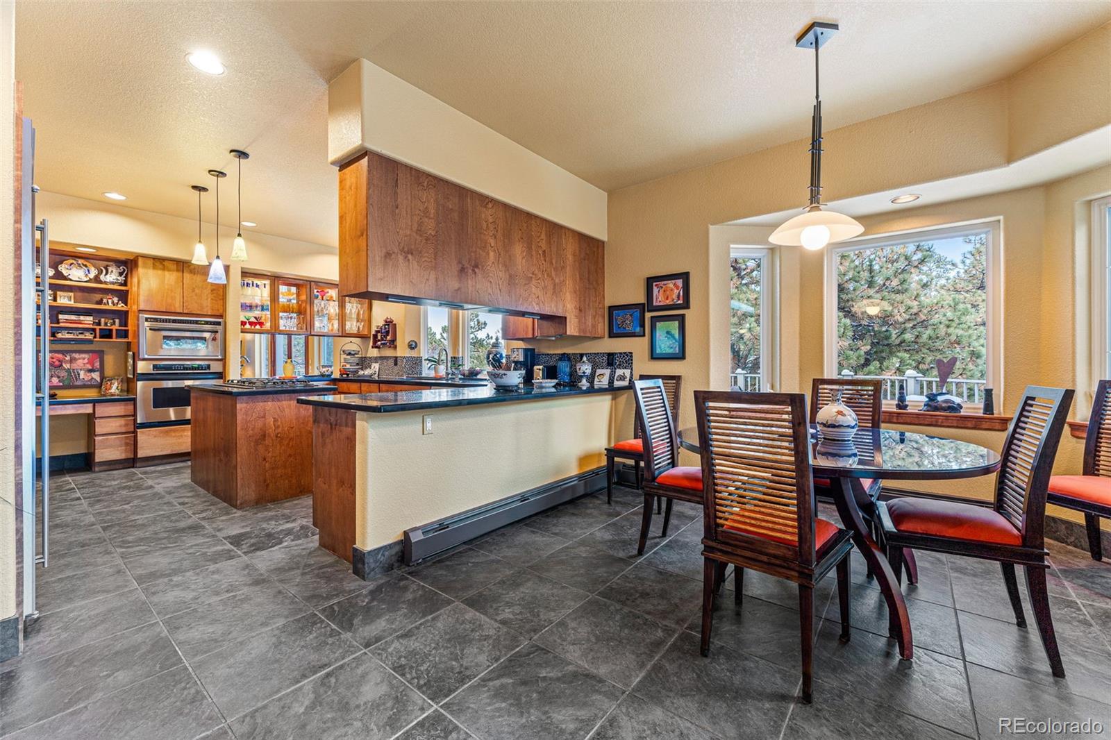 395 Timber Lane Boulder, CO 80304 - Photo 12 of 37 a dining room filled with lots of furniture and a chandelier