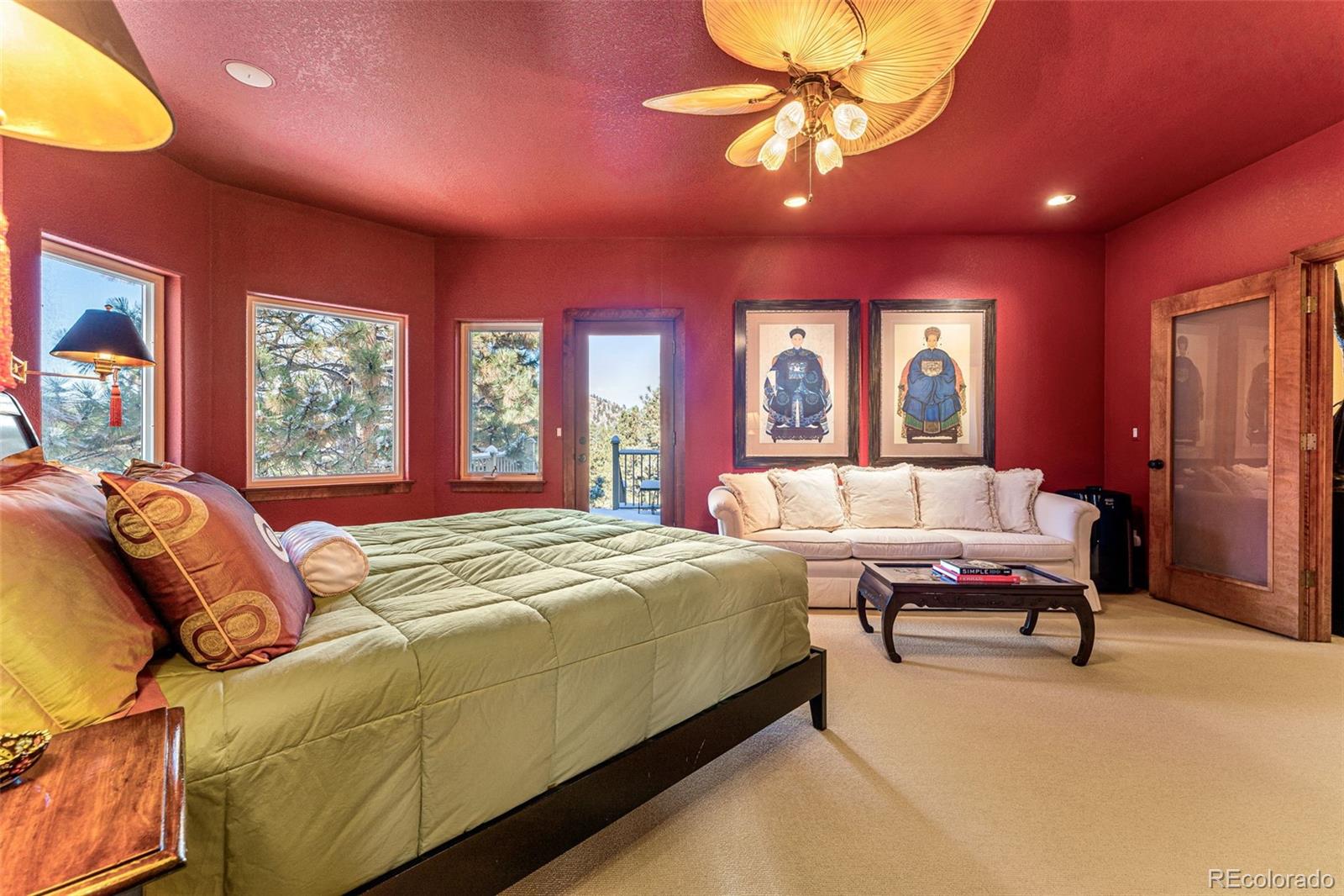 395 Timber Lane Boulder, CO 80304 - Photo 17 of 37 a bedroom with a bed and a chandelier