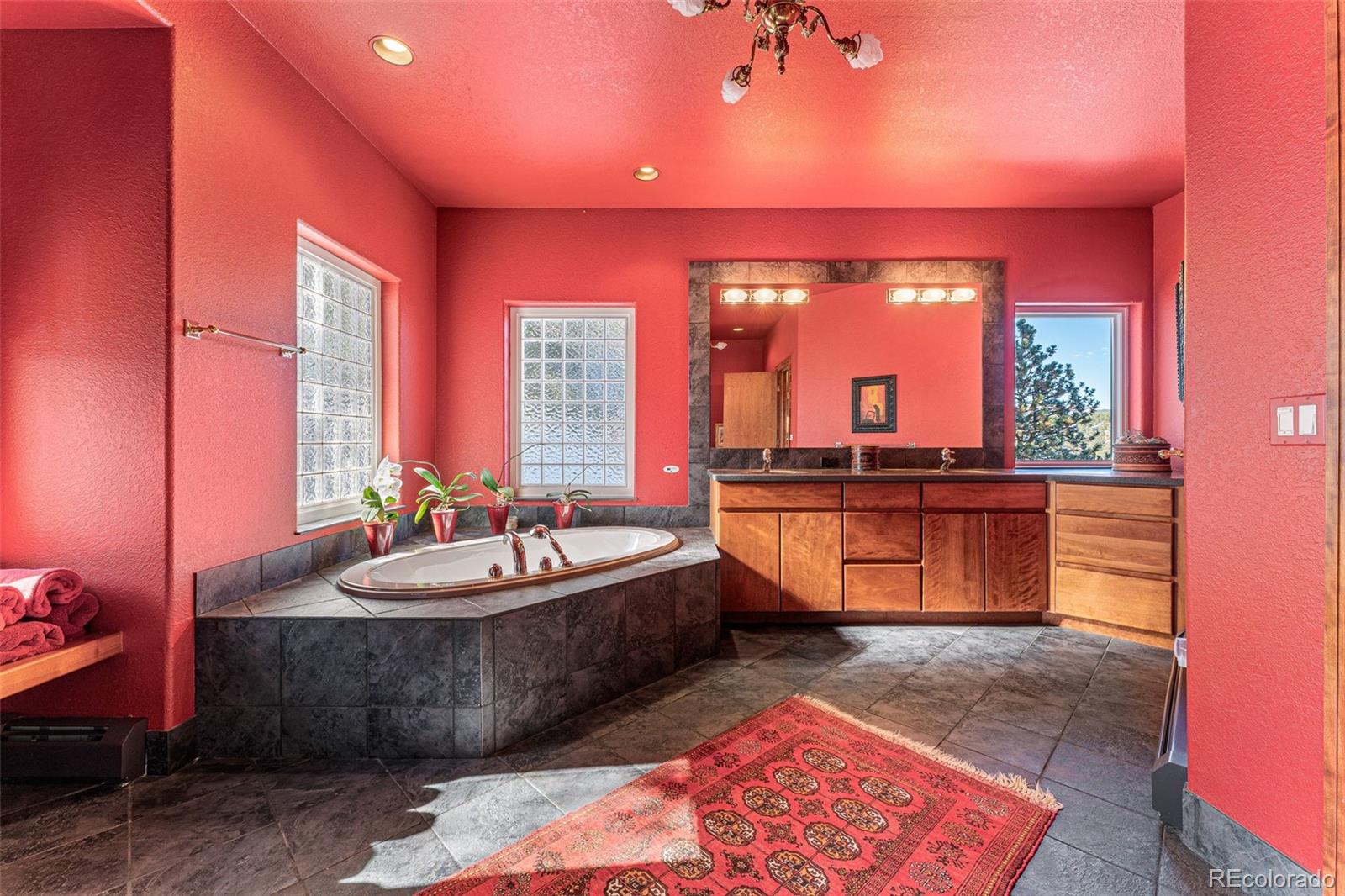 395 Timber Lane Boulder, CO 80304 - Photo 19 of 37 a kitchen with granite countertop a sink and a wooden cabinets