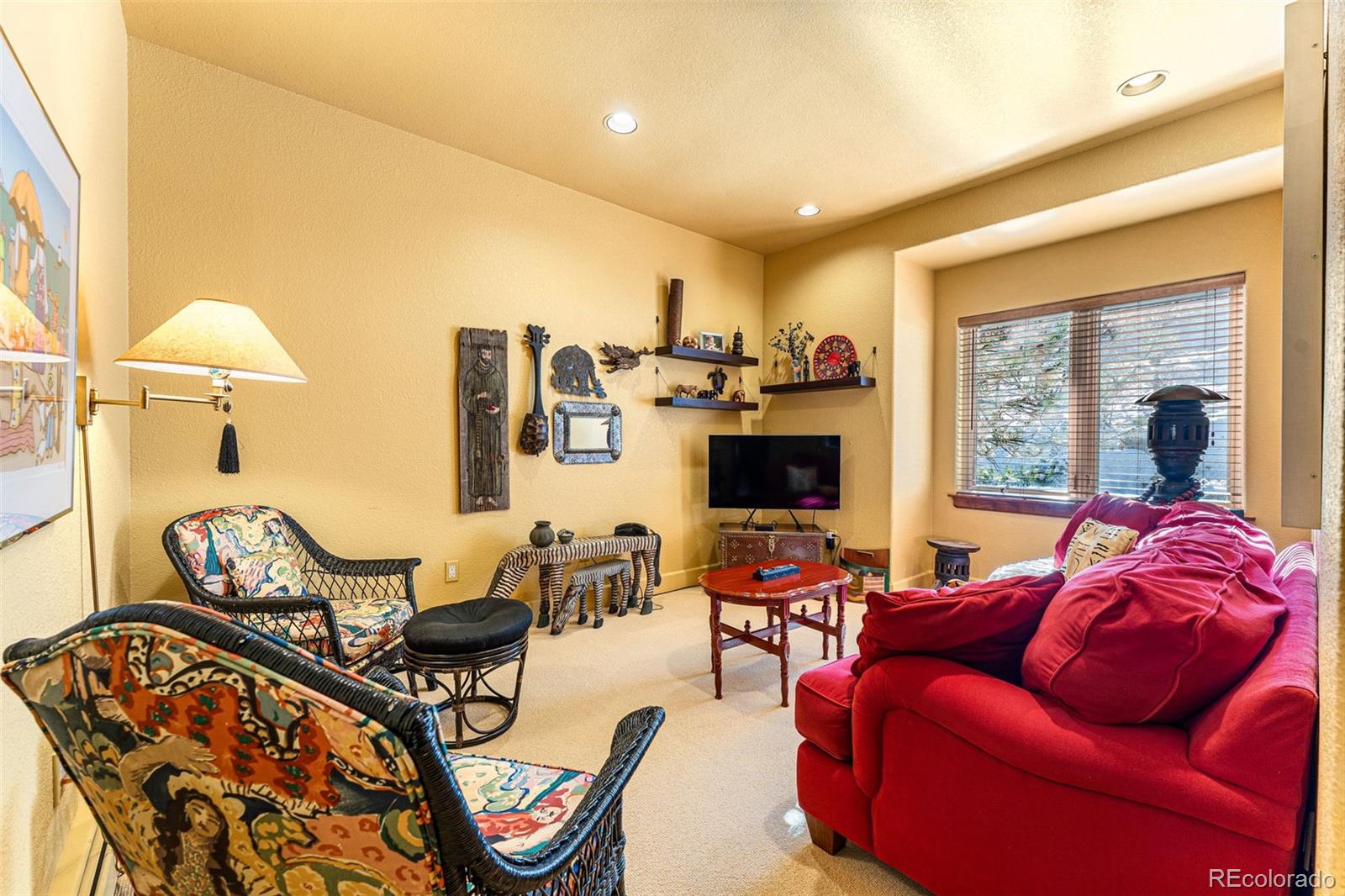 395 Timber Lane Boulder, CO 80304 - Photo 20 of 37 a living room with furniture a flat screen tv and a floor to ceiling window