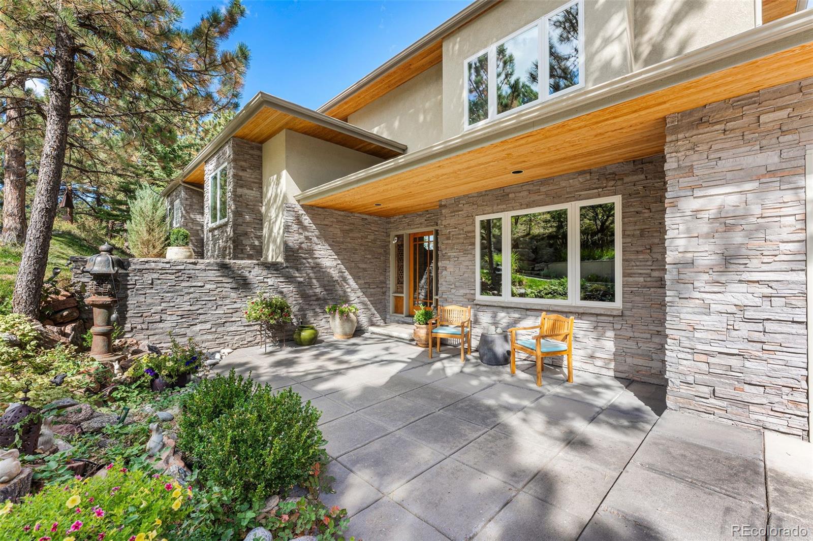 395 Timber Lane Boulder, CO 80304 - Photo 2 of 37 a view of a house with backyard sitting area and porch