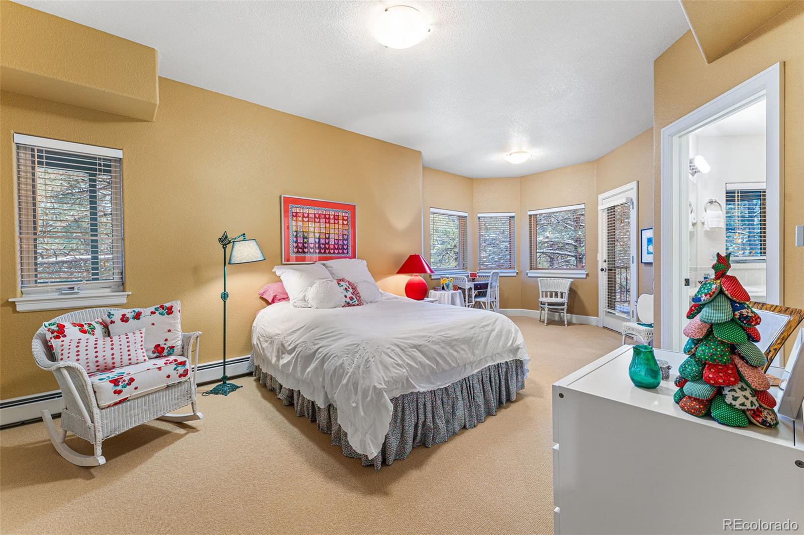 395 Timber Lane Boulder, CO 80304 - Photo 24 of 37 a bedroom with a bed a couch and a window