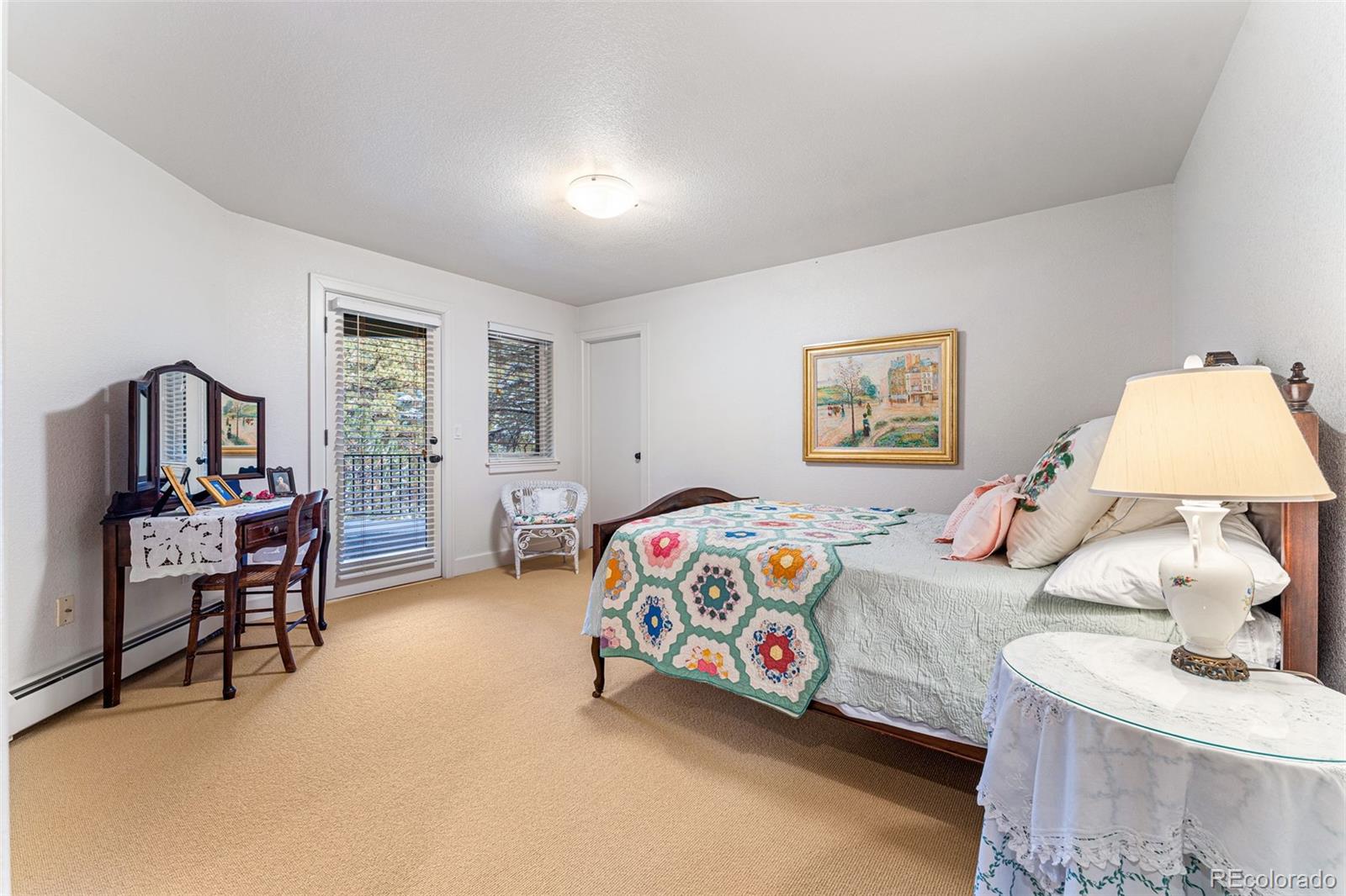 395 Timber Lane Boulder, CO 80304 - Photo 26 of 37 a bedroom with a bed and a table in it