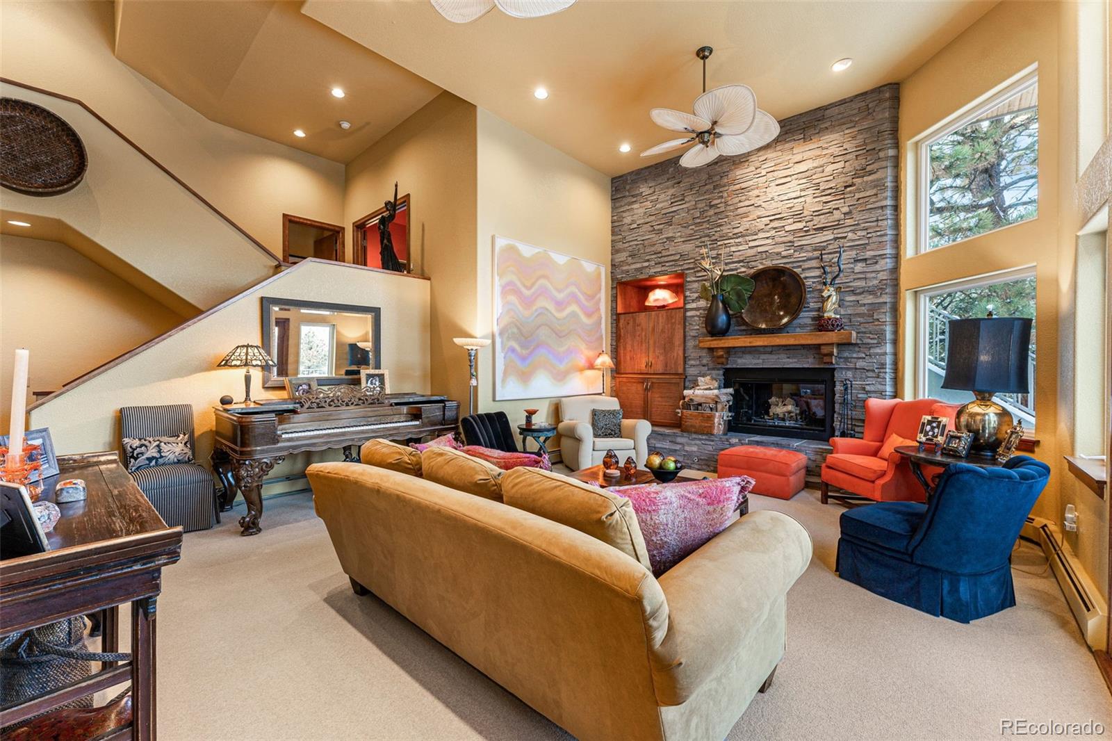 395 Timber Lane Boulder, CO 80304 - Photo 8 of 37 a living room with furniture a fireplace and a flat screen tv