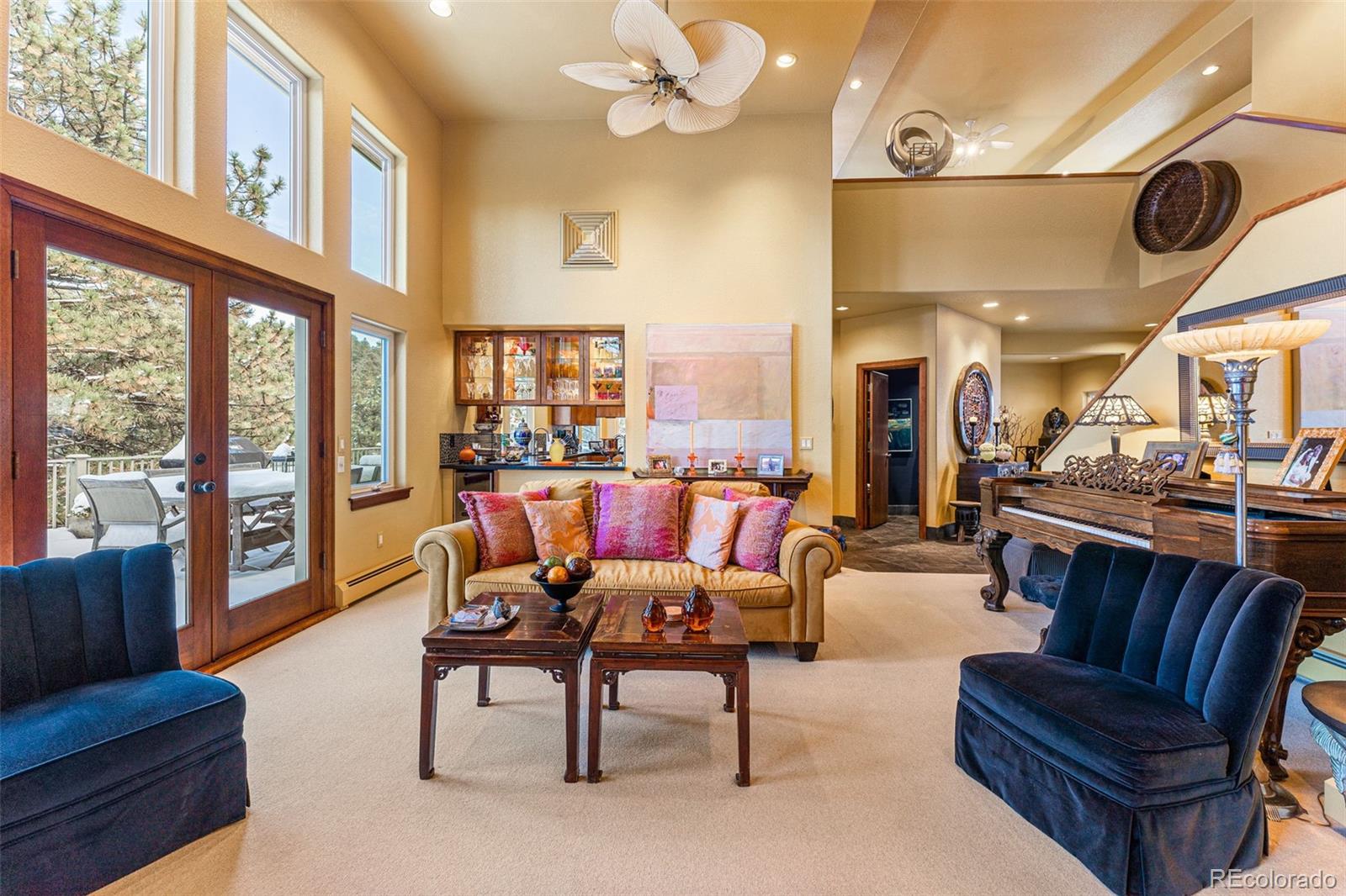 395 Timber Lane Boulder, CO 80304 - Photo 9 of 37 a living room with furniture and a floor to ceiling window