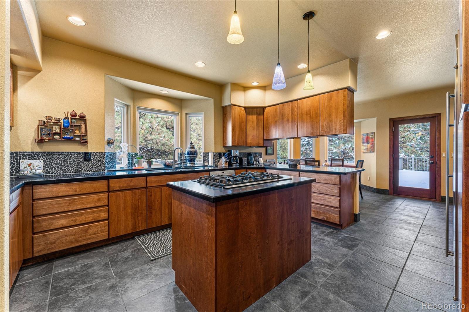 395 Timber Lane Boulder, CO 80304 - Photo 10 of 37 a kitchen with stainless steel appliances granite countertop a stove a sink and a refrigerator