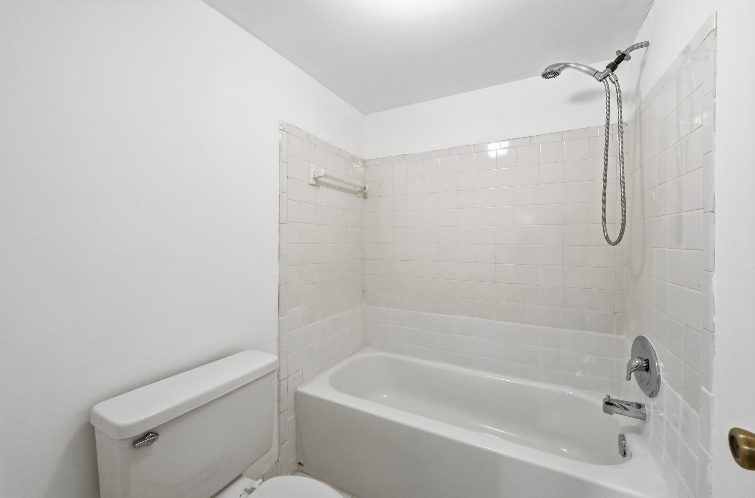 6195 Rock Island Road, Unit 210 Tamarac, FL 33319 - Photo 18 of 26 a bathroom with a bathtub a toilet and a shower