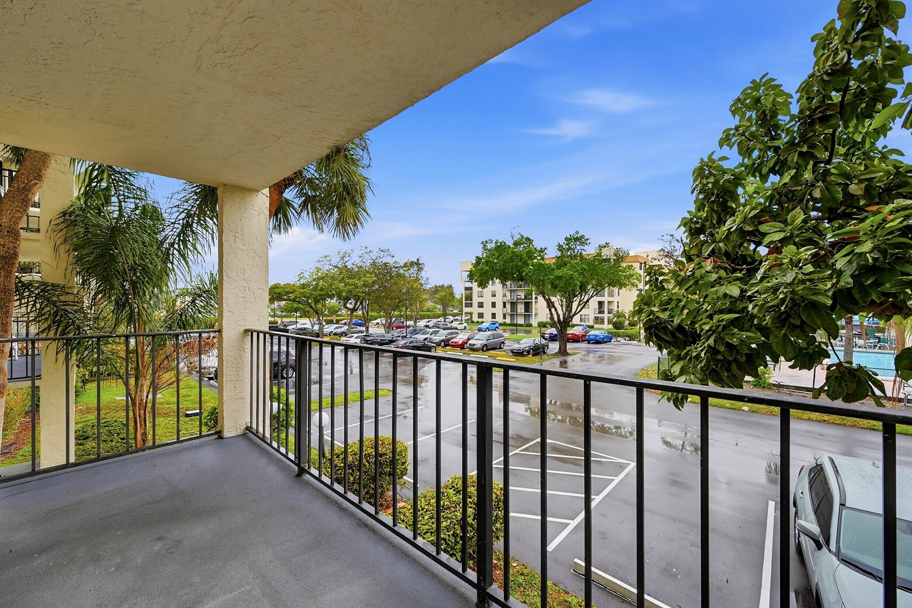 6195 Rock Island Road, Unit 210 Tamarac, FL 33319 - Photo 22 of 26 a view of a balcony
