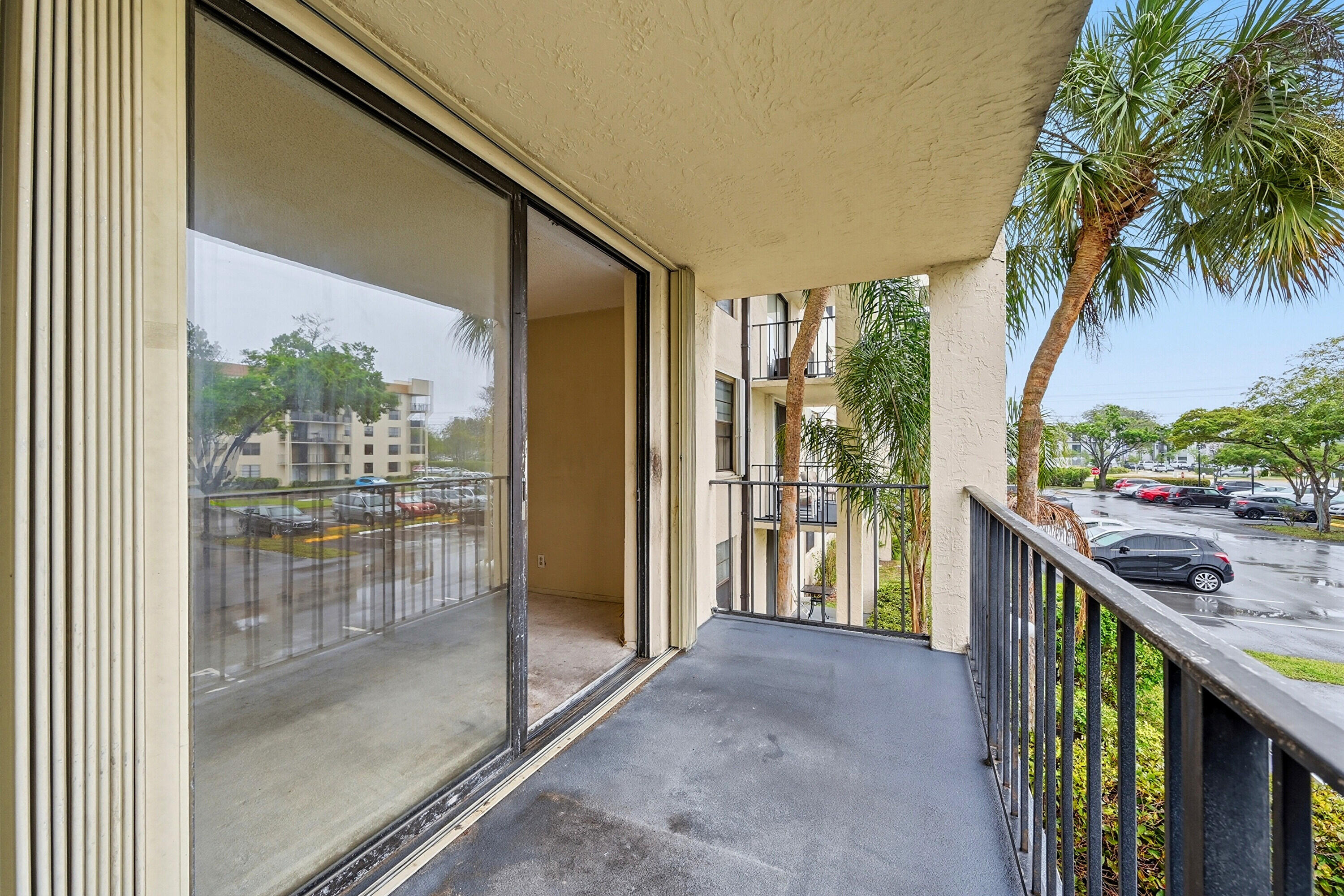 6195 Rock Island Road, Unit 210 Tamarac, FL 33319 - Photo 23 of 26 a balcony view with a outdoor space