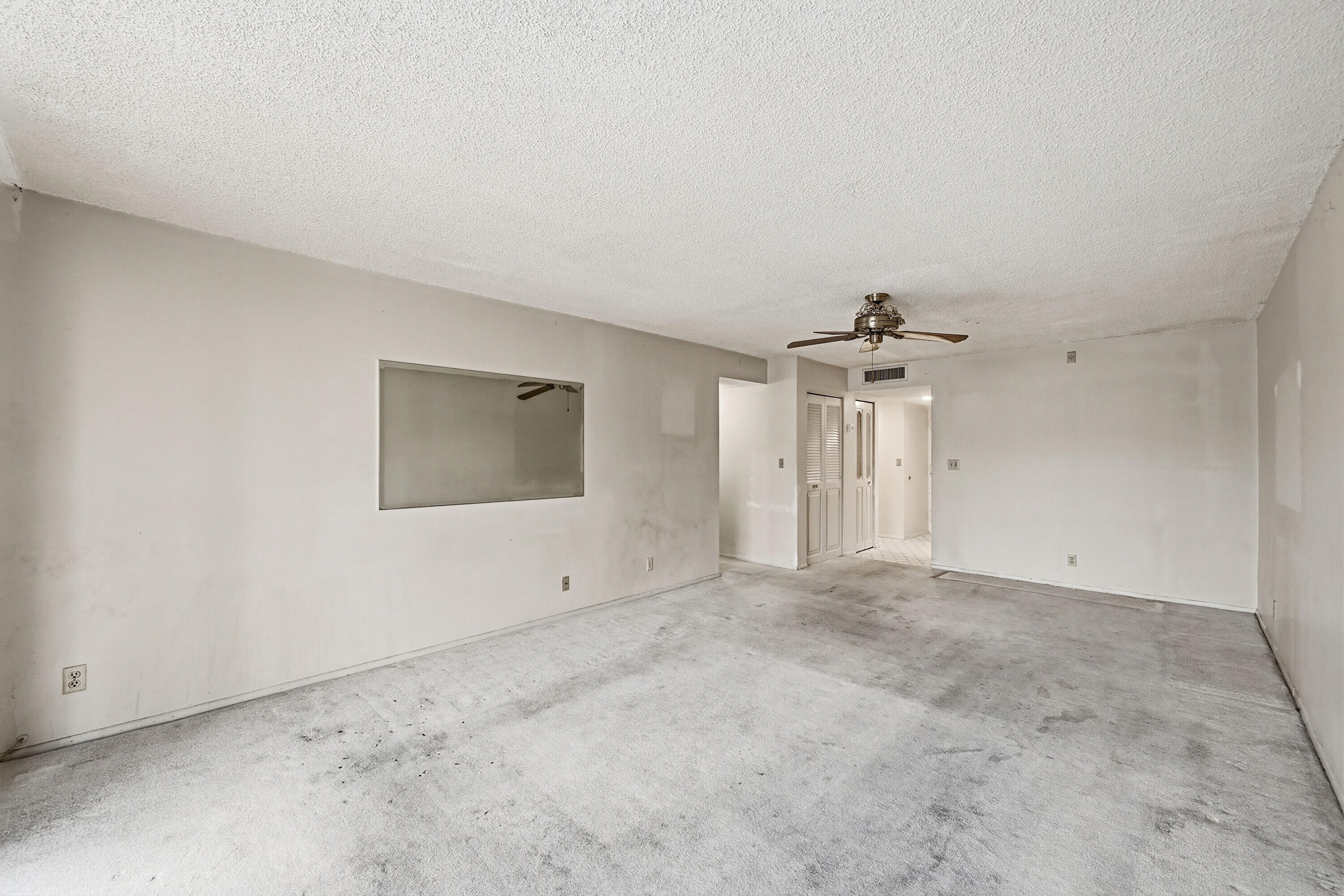 6195 Rock Island Road, Unit 210 Tamarac, FL 33319 - Photo 6 of 26 a view of an empty room with a window