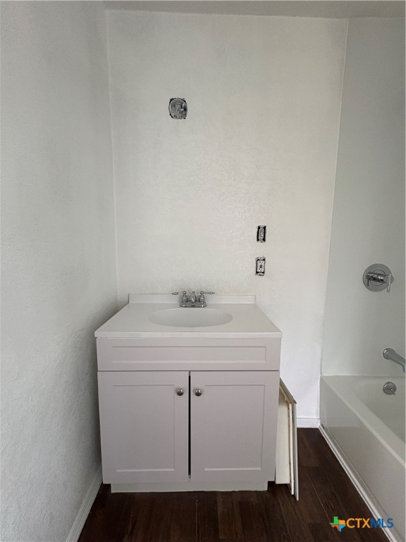 813 South 53rd Street Temple, TX 76504 - Photo 7 of 12 a utility room with a sink a toilet and bathtub