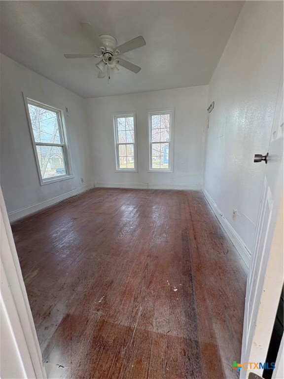 813 South 53rd Street Temple, TX 76504 - Photo 9 of 12 wooden floor in an empty room with a window