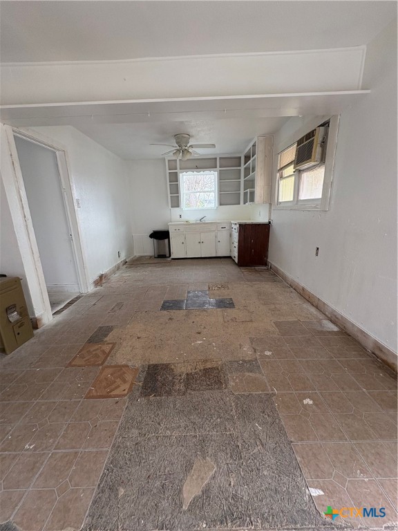 813 South 53rd Street Temple, TX 76504 - Photo 10 of 12 a view of a big room with windows and cabinet
