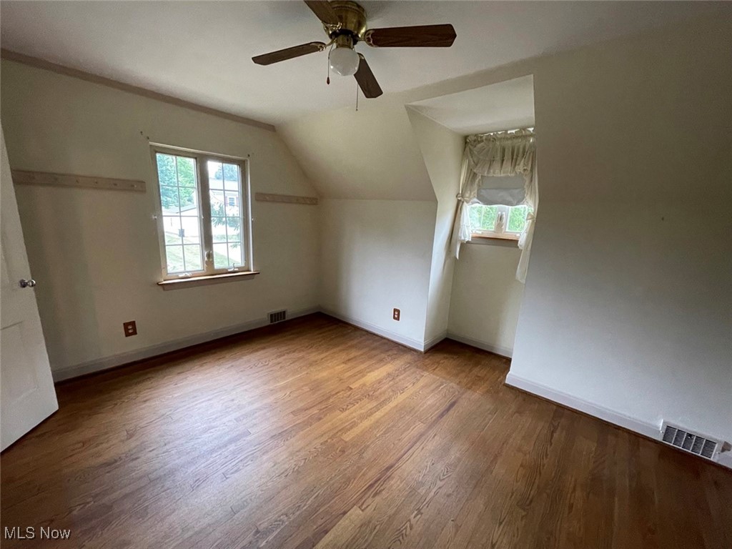 2702 Martin Road Zanesville, OH 43701 - Photo 25 of 34 Bedroom with vaulted ceiling, a wealth of natural light, hardwood / wood-style floors, and ceiling fan