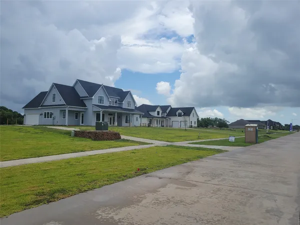 a front view of house with outdoor space and yard