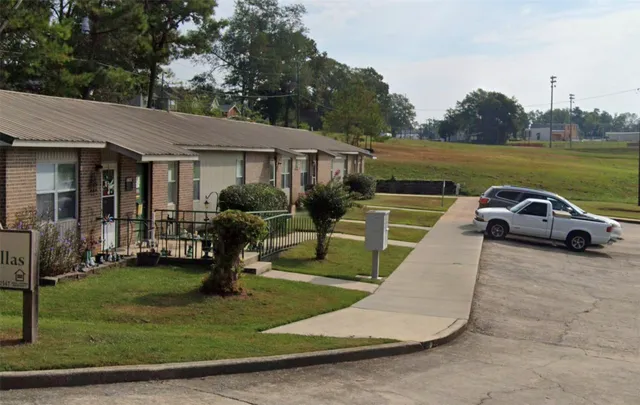 a view of a house with swimming pool and a yard