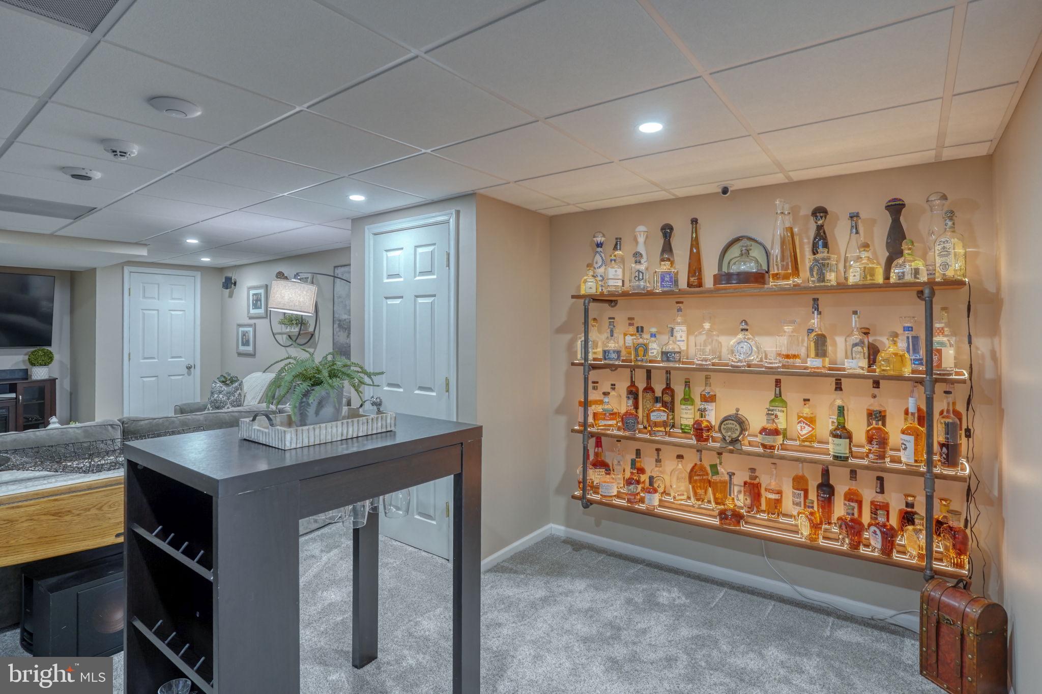247 Cider Run Magnolia, DE 19962 - Photo 33 of 44 Bar Area Liquor Display