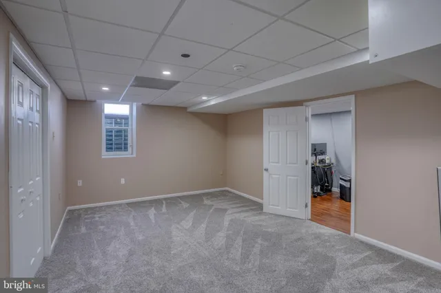 a view of an empty room with glass door