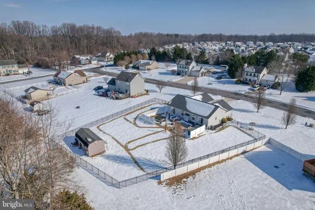 a view of a backyard and swimming pool