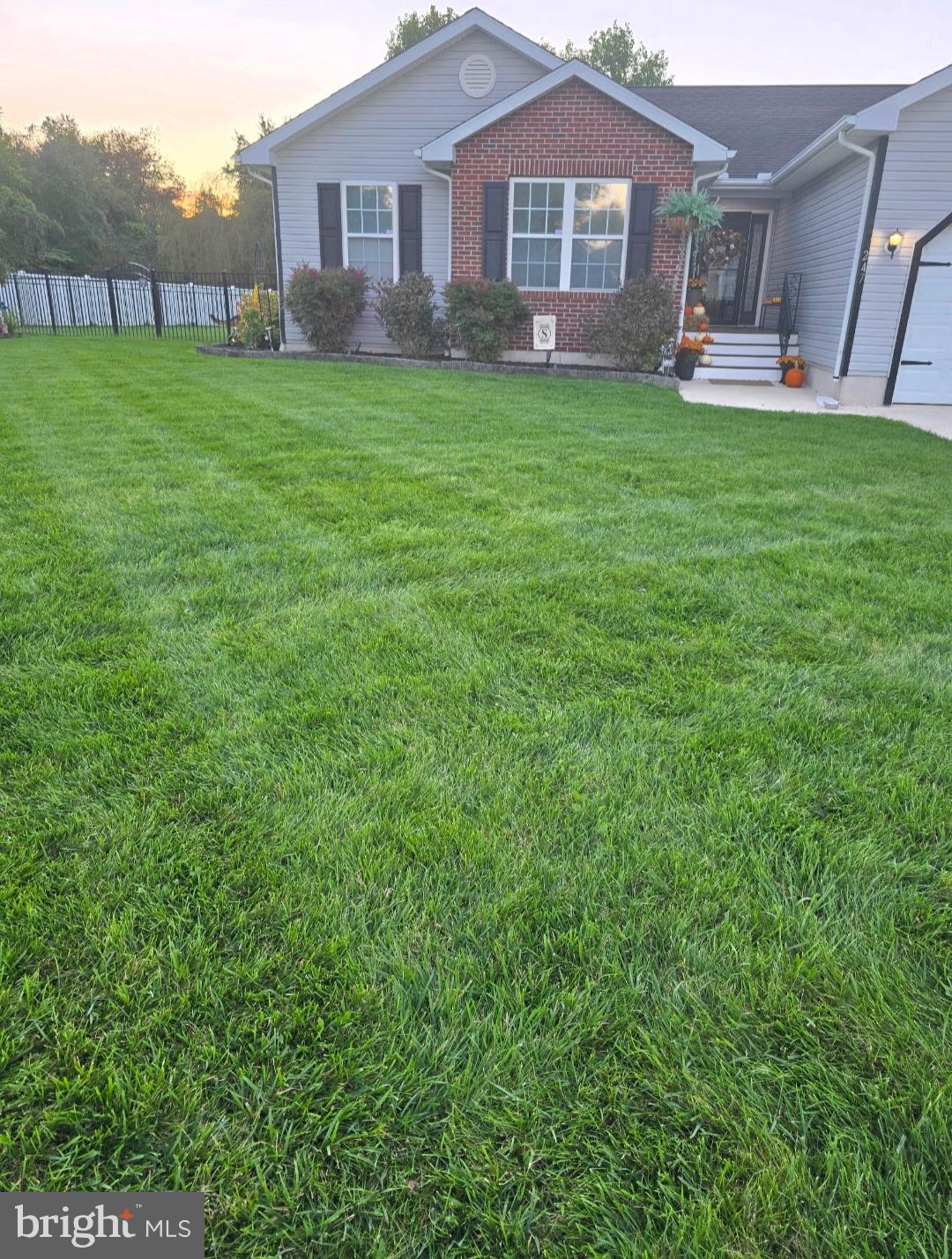 247 Cider Run Magnolia, DE 19962 - Photo 7 of 15 a front view of a house with a garden and trees
