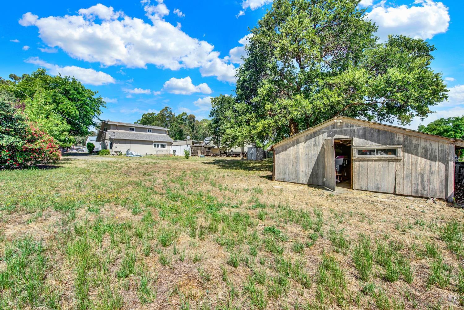 4851 Udell Road Vacaville, CA 95688 - Photo 55 of 65 a backyard of a house with lots of green space