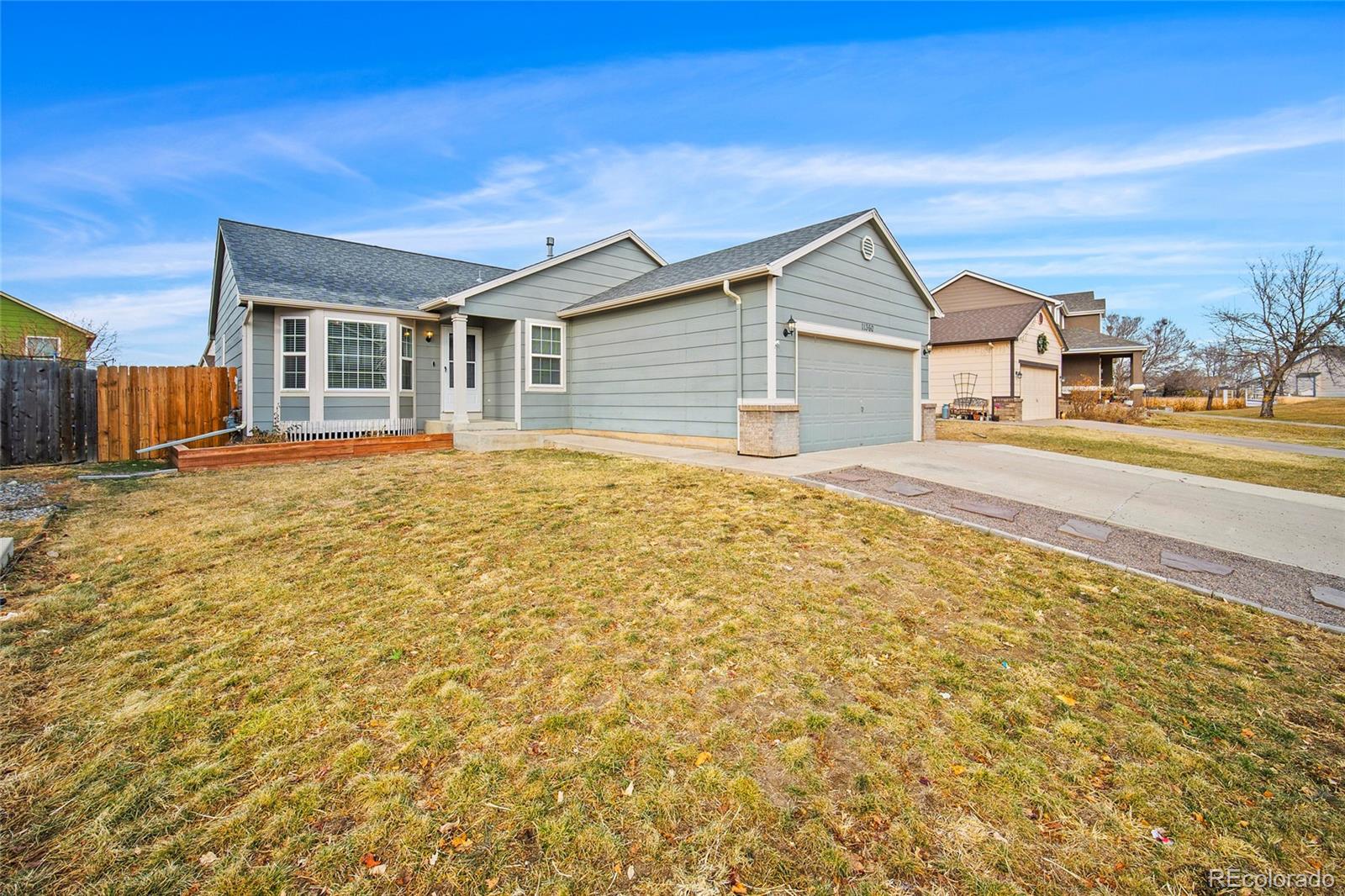 11360 Berry Farm Road Fountain, CO 80817 - Photo 2 of 44 a house view with a garden space