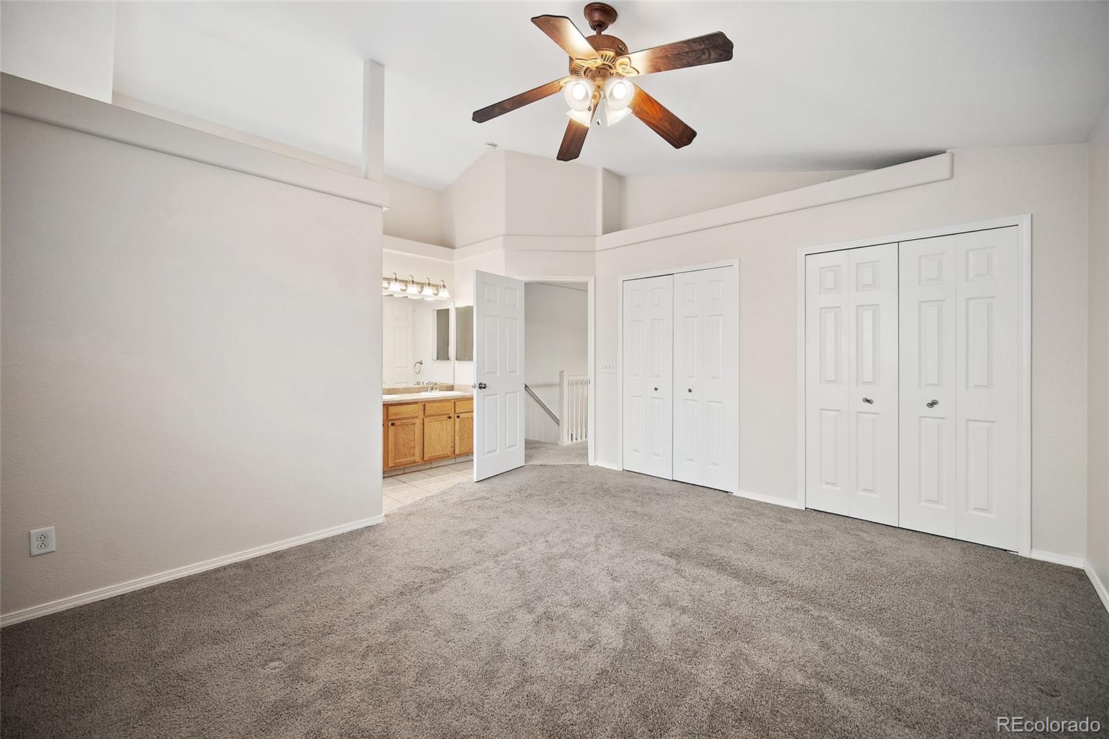 11360 Berry Farm Road Fountain, CO 80817 - Photo 21 of 44 a view of a big room with wooden floor and cabinet in a room