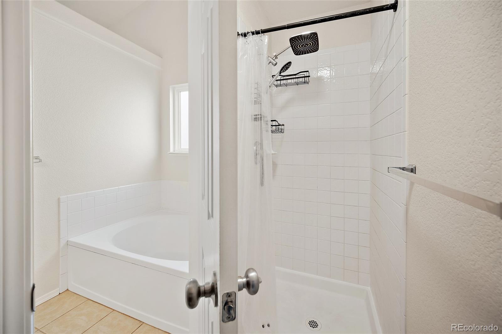 11360 Berry Farm Road Fountain, CO 80817 - Photo 25 of 44 a bathroom with a bathtub