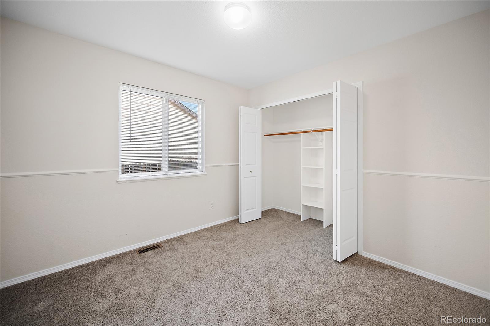 11360 Berry Farm Road Fountain, CO 80817 - Photo 27 of 44 a view of an empty room with a window