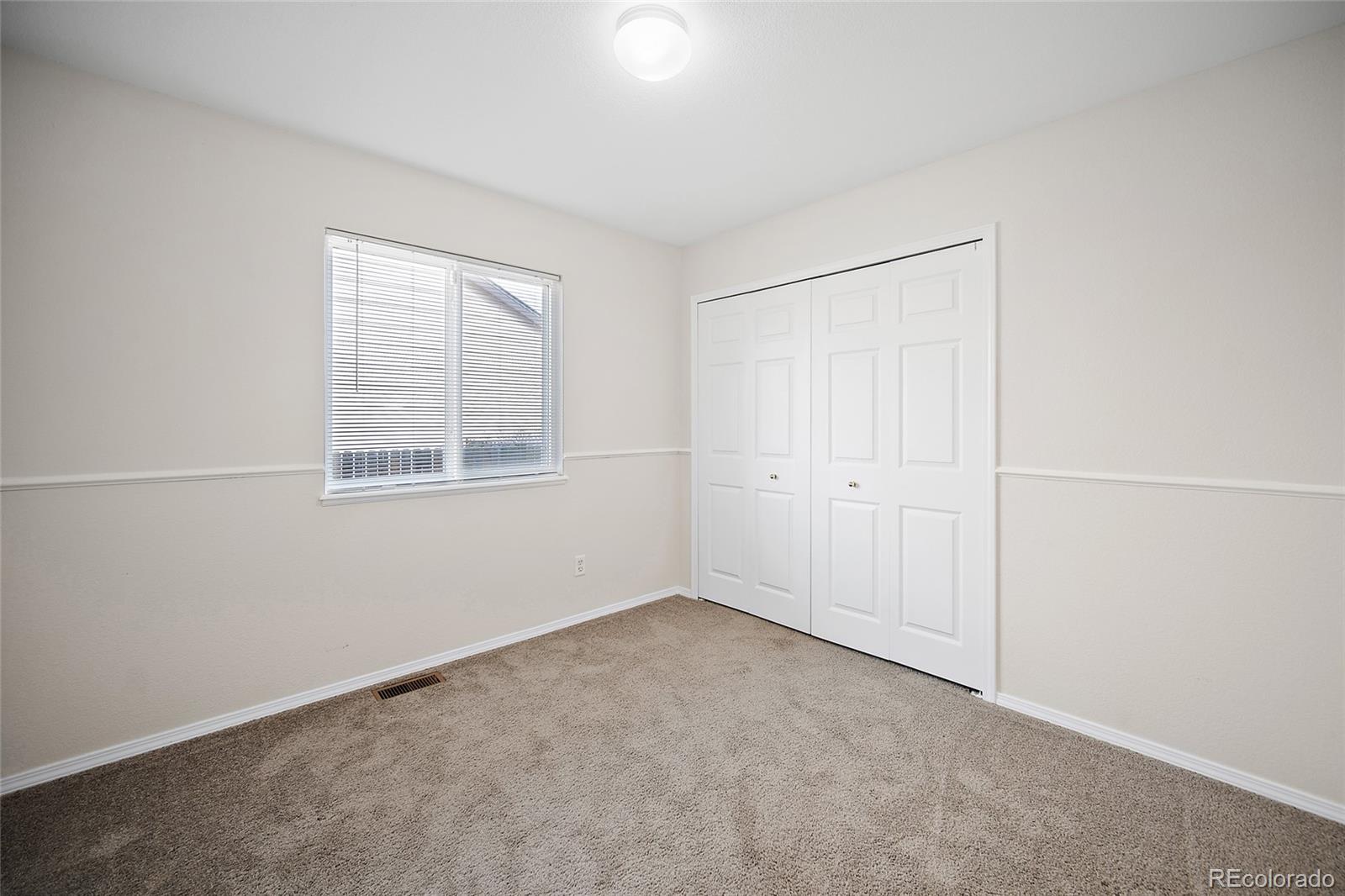 11360 Berry Farm Road Fountain, CO 80817 - Photo 28 of 44 a view of an empty room with a window