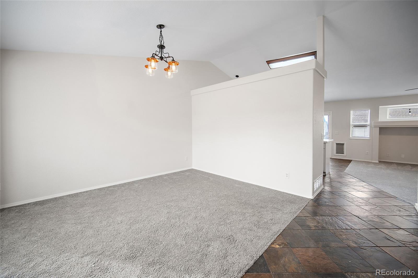 11360 Berry Farm Road Fountain, CO 80817 - Photo 4 of 44 wooden floor in an empty room with a window