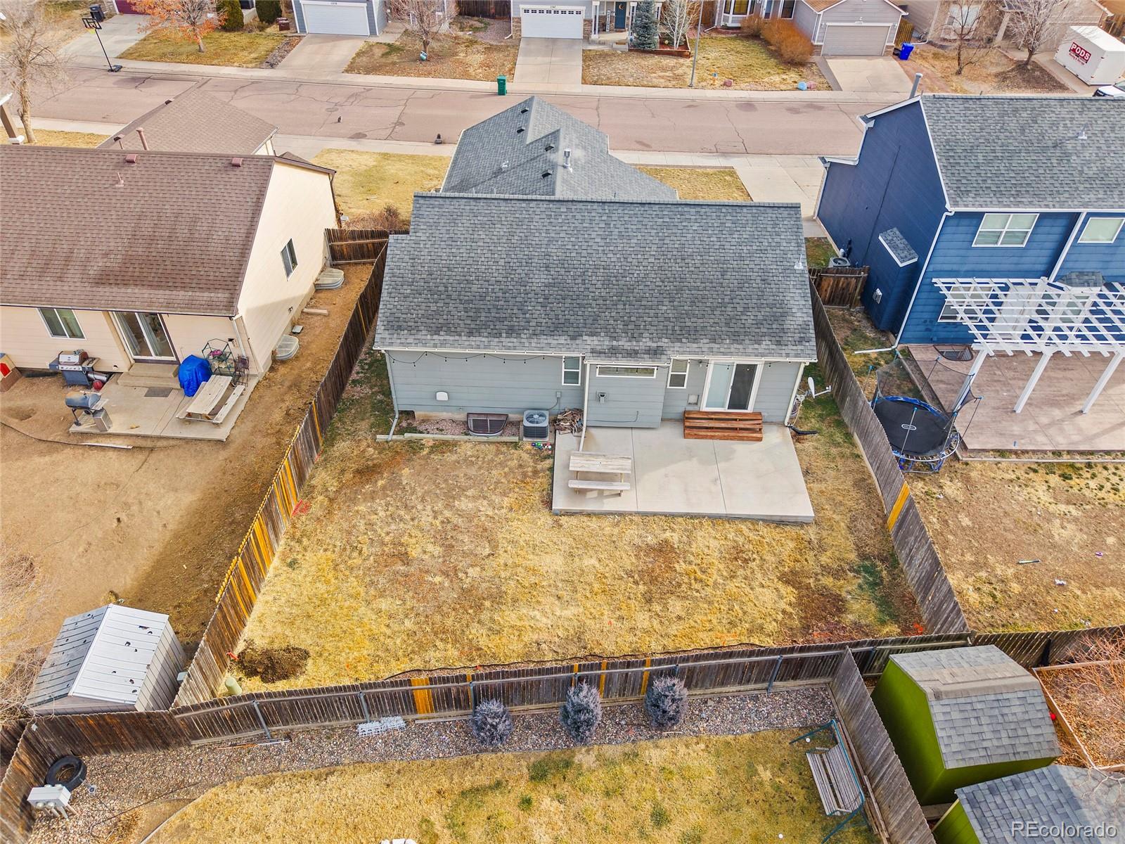 11360 Berry Farm Road Fountain, CO 80817 - Photo 42 of 44 a living room with furniture and a table