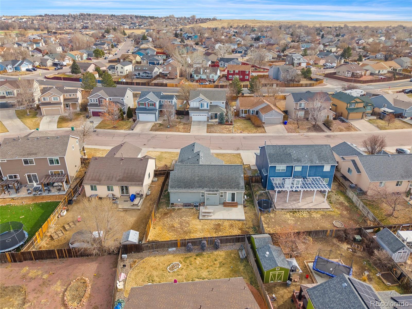 11360 Berry Farm Road Fountain, CO 80817 - Photo 43 of 44 an aerial view of a house with a swimming pool